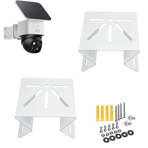 Deux supports d’angle en métal pour caméra, dont un installé sur un mur extérieur en pierre claire