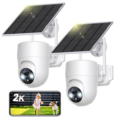 Deux caméras solaires extérieures blanches orientables avec leurs panneaux, posées sur un muret de pierre claire.